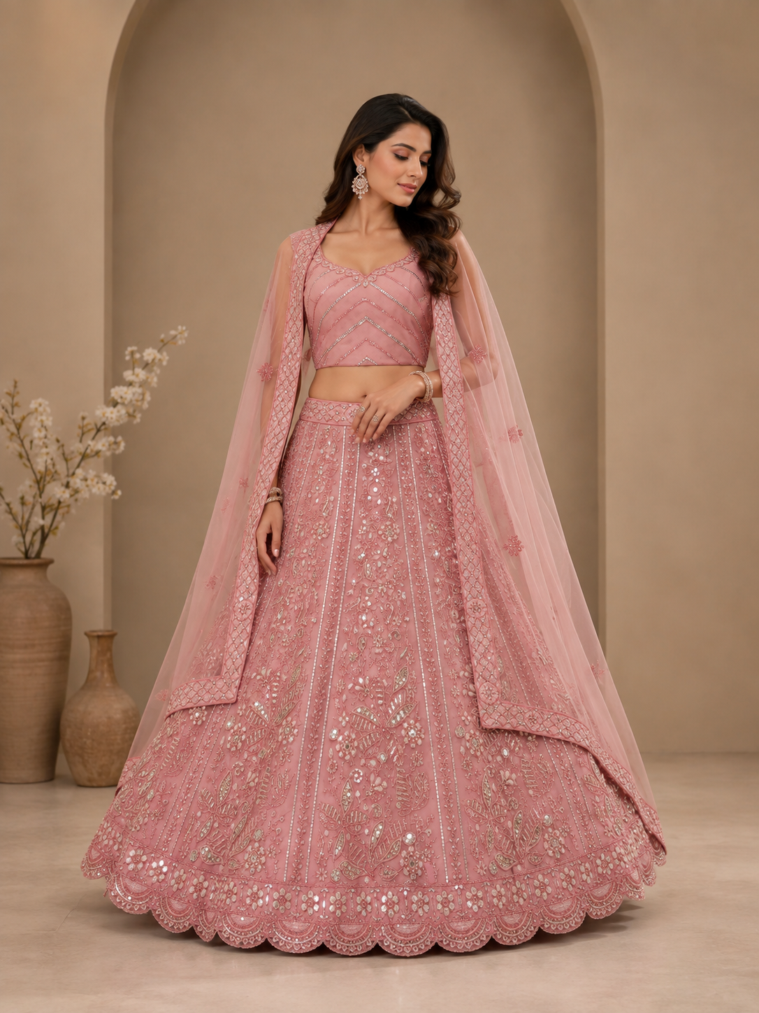 Sejal baby pink net lehenga choli set with silver thread embroidery and sequin embellishment front view